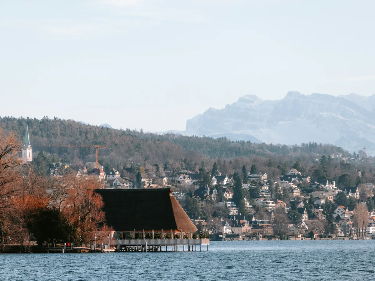 Lake Zürich and the left-shore village of Kilchberg with the Alps in the distance