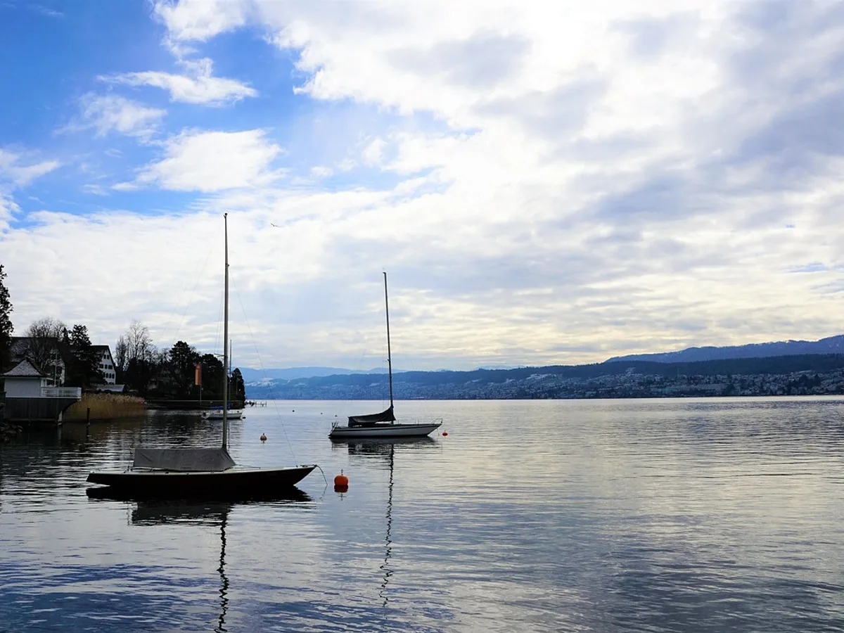 Moored sailboats on Lake Zürich along the Küsnacht shoreline on the Goldküste